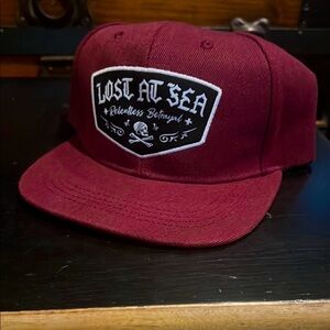 RELENTLESS BETRAYAL LOST AT SEA FLAT BILL ADJUSTABLE HAT